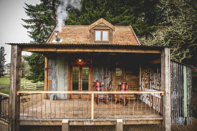 Rowan two-storey cabin in Northumberland with smoking chinmey. Take in the fresh air, sitting in a rocking chair on the decking