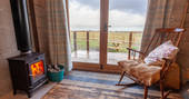 Lottie's Cabin - wood burner and view from the living room double doors, Hillside Huts & Cabins, Morpeth, Northumberland