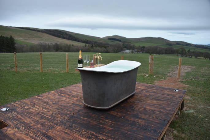 Relax in the outdoor bath tub at Cheviot and sip a glass of bubbly whilst enjoying the views of Northumberland 
