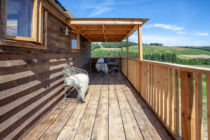 Sit on the balcony and look at the views over Northumberland at Cheviot cabin