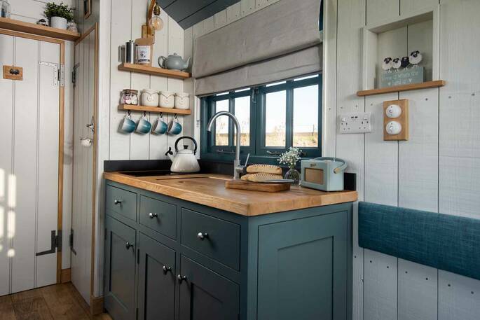 Kitchen equipped with a two ring hob, kettle and toaster