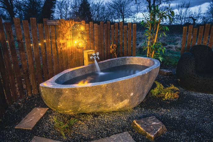 Outdoor bath tub at The Glebe Retreat, Cabin, Northumberland, England