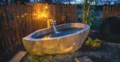 Outdoor bath tub at The Glebe Retreat, Cabin, Northumberland, England