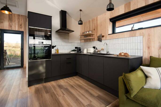 Kitchen equipped with an oven, stove, microwave and all cooking utensils