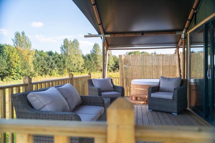 Outdoor seating on the decking of your safari tent at Bird Holme Glamping in Nottinghamshire
