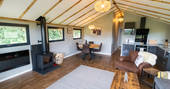 Open plan living area and fully equipped kitchen inside your safari lodge at Bird Holme Glamping in Nottinghamshire