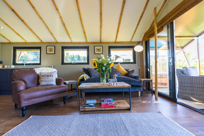Living room area inside the safari lodge at at Bird Holme Glamping in Nottinghamshire