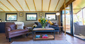 Living room area inside the safari lodge at at Bird Holme Glamping in Nottinghamshire