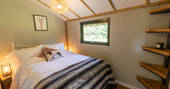 One double bed inside your safari lodge at Bird Holme Glamping in Nottinghamshire