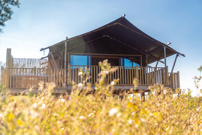 Osprey, the safari lodge, next to the pond at Bird Holme Glamping in Nottinghamshire