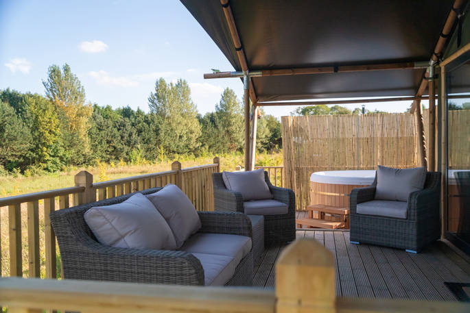 Outdoor seating on the decking of your safari tent at Bird Holme Glamping in Nottinghamshire