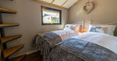 Two single beds inside your safari lodge at Bird Holme Glamping in Nottinghamshire
