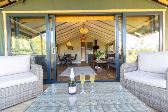 Crack open a bottle of champagne on your decking at Osprey cabin in Nottinghamshire