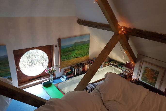 Cosy king-size bed upstairs at Beacon Hill Barn in Oxfordshire 