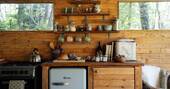 Kitchen equipped with an oven, hob and undercounter fridge