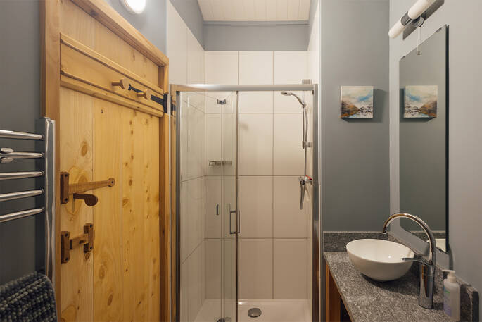 Shower, sink and flushing toilet