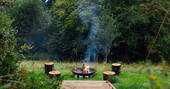 Spacious firepit area in the gardn