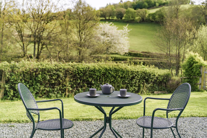 Aether's Tilt cabin outdoors table at Offa's Pitch, Craven Arms, Shropshire