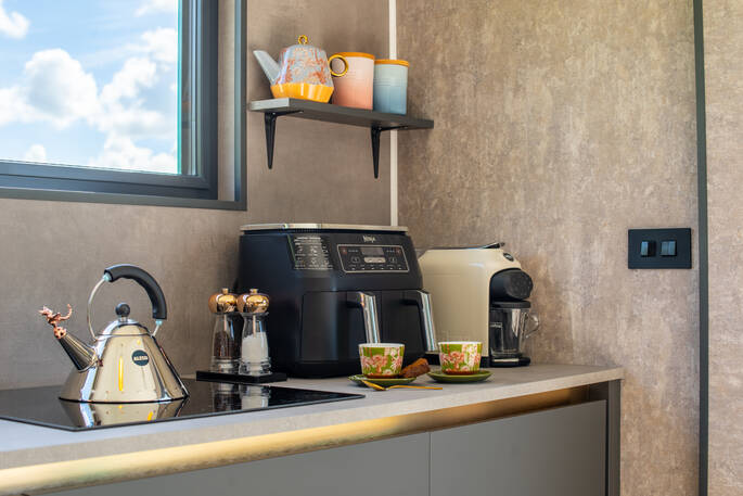 Kitchen includes airfyer, kettle, coffee machine  and an induction hob