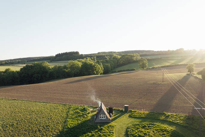 Wide view of cabin and fields