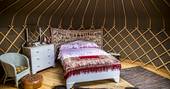 Interior bed and dresser at Buffalo Springfield Yurt, Shropshire