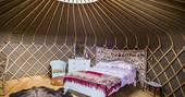 View of bed in yurt at Buffalo Springfield Yurt, Shropshire