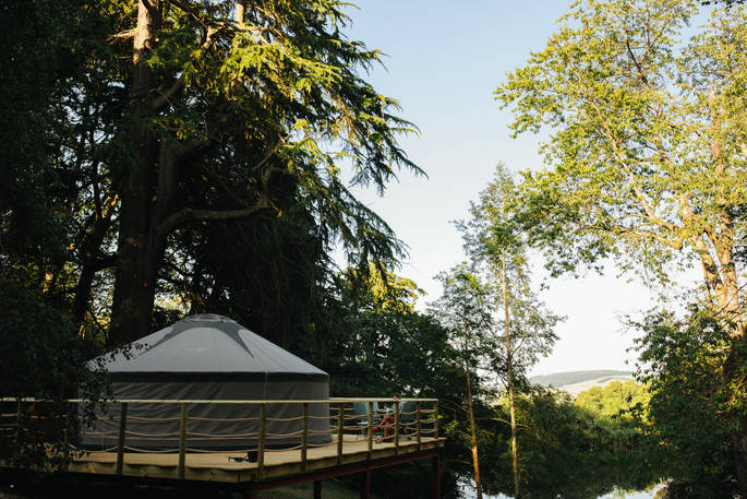 Sit outside on the decking with a glass of wine outside Harvest Moon Yurt at Walcot Hall