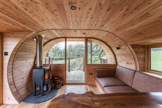 Stay cosy by the logburner inside Cheriton Treehouse in Somerset