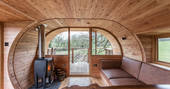 Stay cosy by the logburner inside Cheriton Treehouse in Somerset