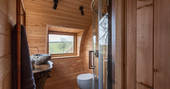 Cheriton Treehouse bathroom with flushing toilet, hot shower and stone basin 