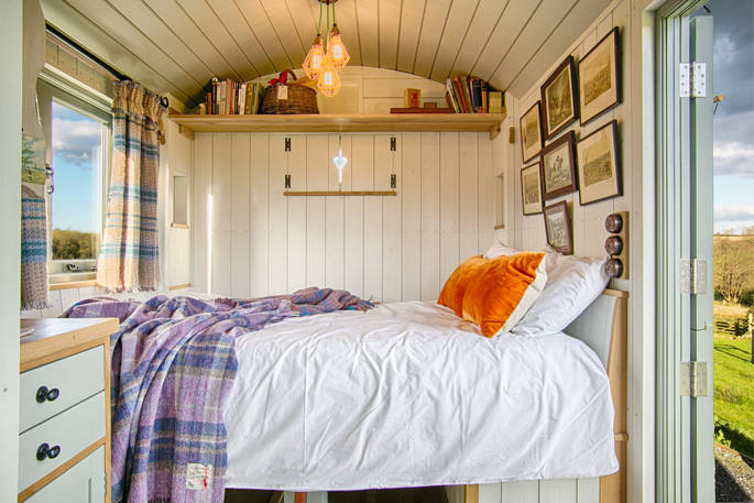 Cosy double bed inside Dimpsey, the shepherds hut in Somerset 