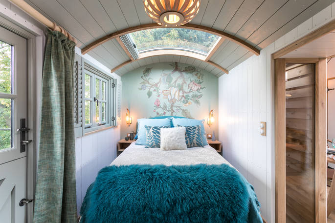 Double bed with skylight above so you can fall asleep whilst watching the stars at Dimpsey Yonder Shepherd's Hut in Somerset