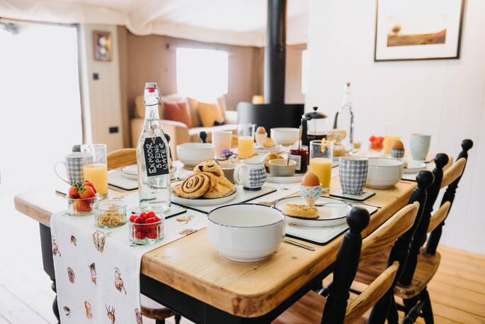 Dining table with seating for 4 in the safari tent