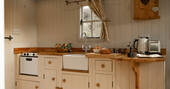 Kitchen equipped with a hob, oven, kettle, toaster, microwave and undercounter fridge