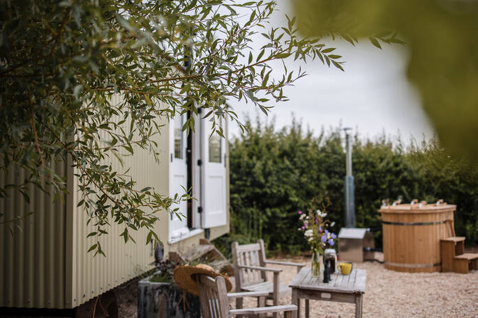 Front garden with a hot tub and firepit