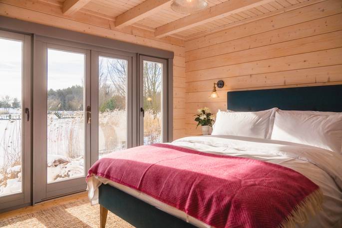 Discovery Lodge cabin bedroom with view, Blyth Rise Stays, Laxfield, Suffolk