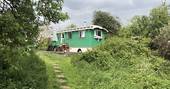An exterior view of the Green Fairground Wagon in Suffolk