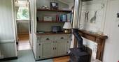 The cosy interior of Green Fairground Wagon in Suffolk