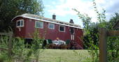 Exterior of Maroon Fairground Wagon at Coppins Farm in Suffolk
