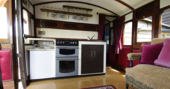 Fully equipped kitchen inside The Victorian Railway Carriage at Coppins Farm in Suffolk  