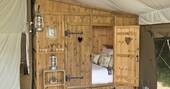Luxury Lodge Tent 031 2022 Cupboard Bed by Chris Rawlings - cropped