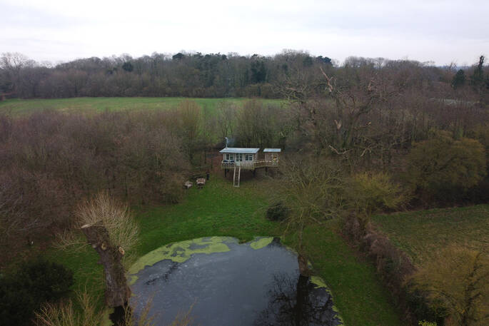 Arial view of the treehouse showing the lake its opposite