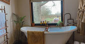 Meadow Cabin at Beneath The Branches indoor bath tub, Ashurst, Sussex, England