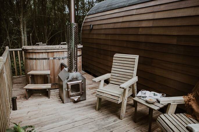 Wood-fired hot tub and outdoor seating area