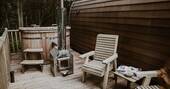 Wood-fired hot tub and outdoor seating area