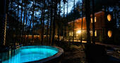 Nightime hot tub and cabin