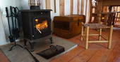 Get toasty by the wood-burner in Orinoco Cabin at Forest Garden in Sussex