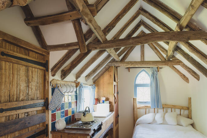 Lie on the bed and stare up at the craftsmanship of Meadow keeper's cottage in Sussex