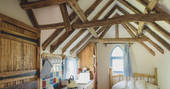 Lie on the bed and stare up at the craftsmanship of Meadow keeper's cottage in Sussex