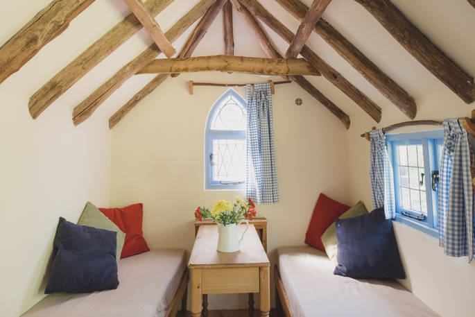 The fresh, bright interior of Meadow keeper's cottage in Sussex